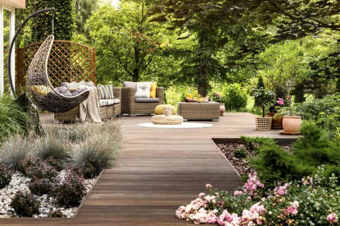 Stunning-backyard-deck-with-hammock-garden-and-trees