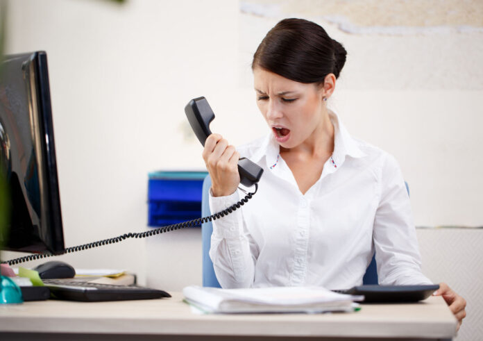 32331259 - angry woman shouting at phone