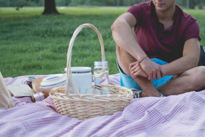 man sitting near basket photo