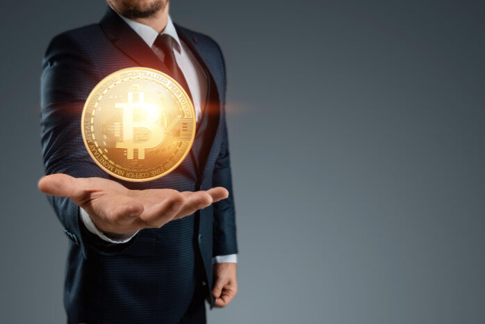 bitcoin-coin-hands-businessman-electronic-money-concept-mining-electronic-money-blockchain-cryptocurrency-data-encryption-mixed-media
