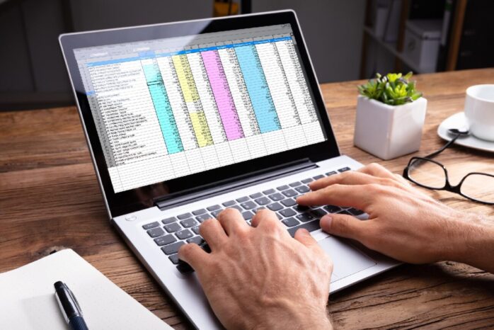 Person's Hand Using Laptop