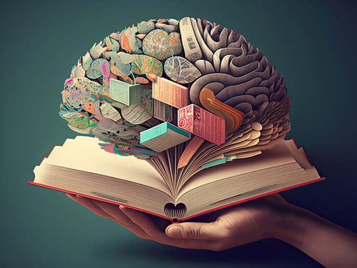 Human brain on a book and color background. Minimal abstract con
