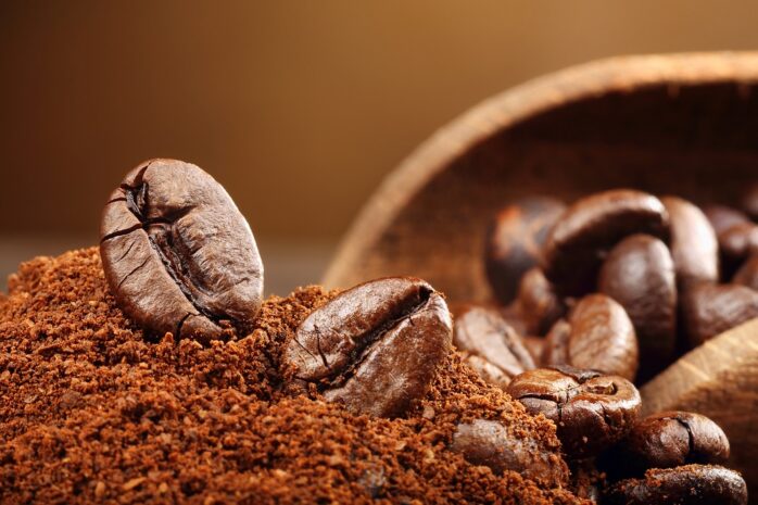 Coffee beans macro on a brown background