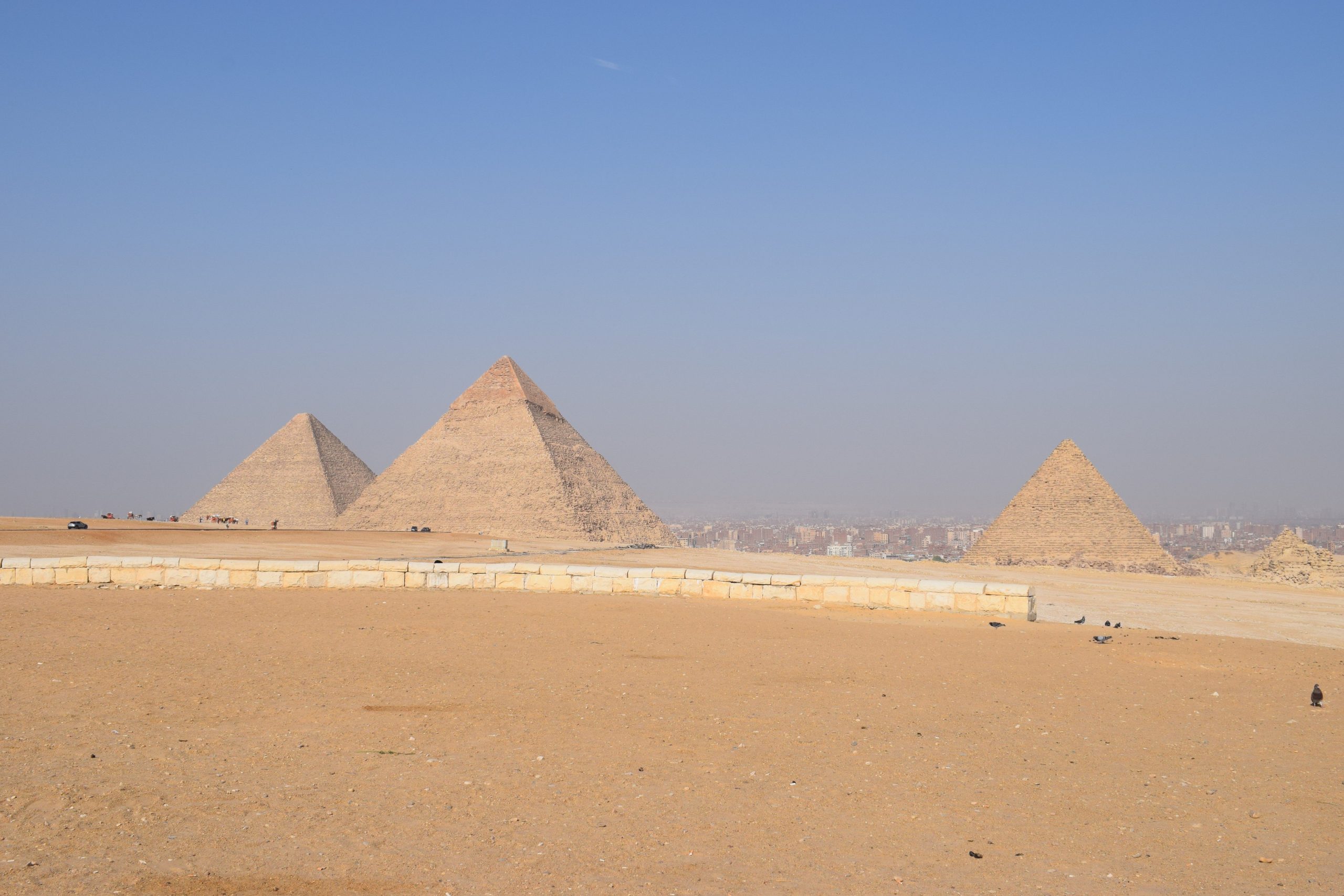 Breathtaking landscape of the Giza Pyramids under a clear blue sky in Cairo, Egypt